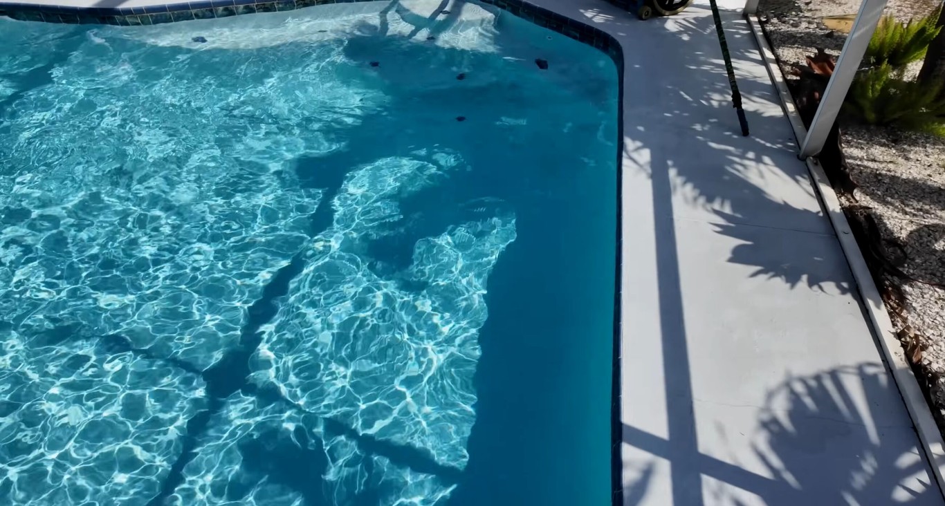 Professional weekly pool cleaning service in Hawthorne, CA showing crystal clear water